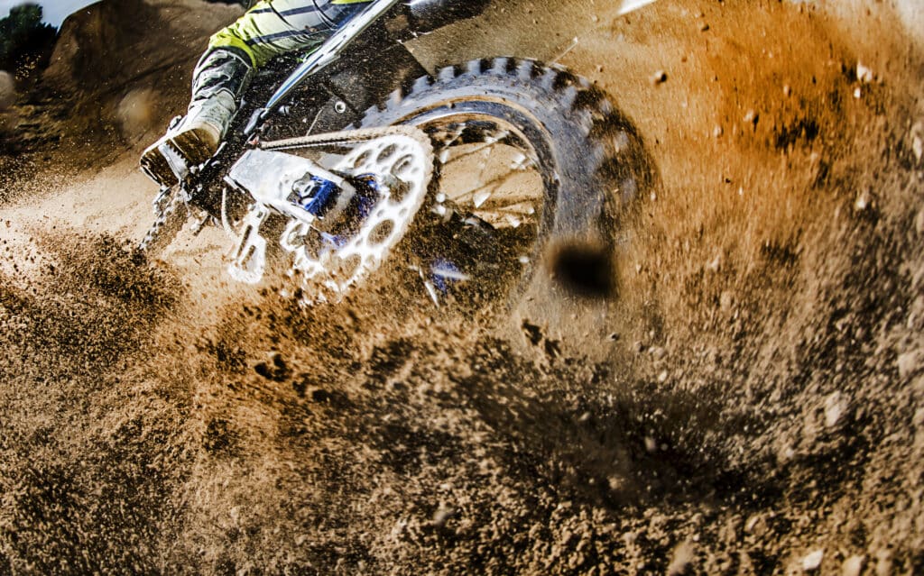 Motorcycle wheel skids very close to the photographer