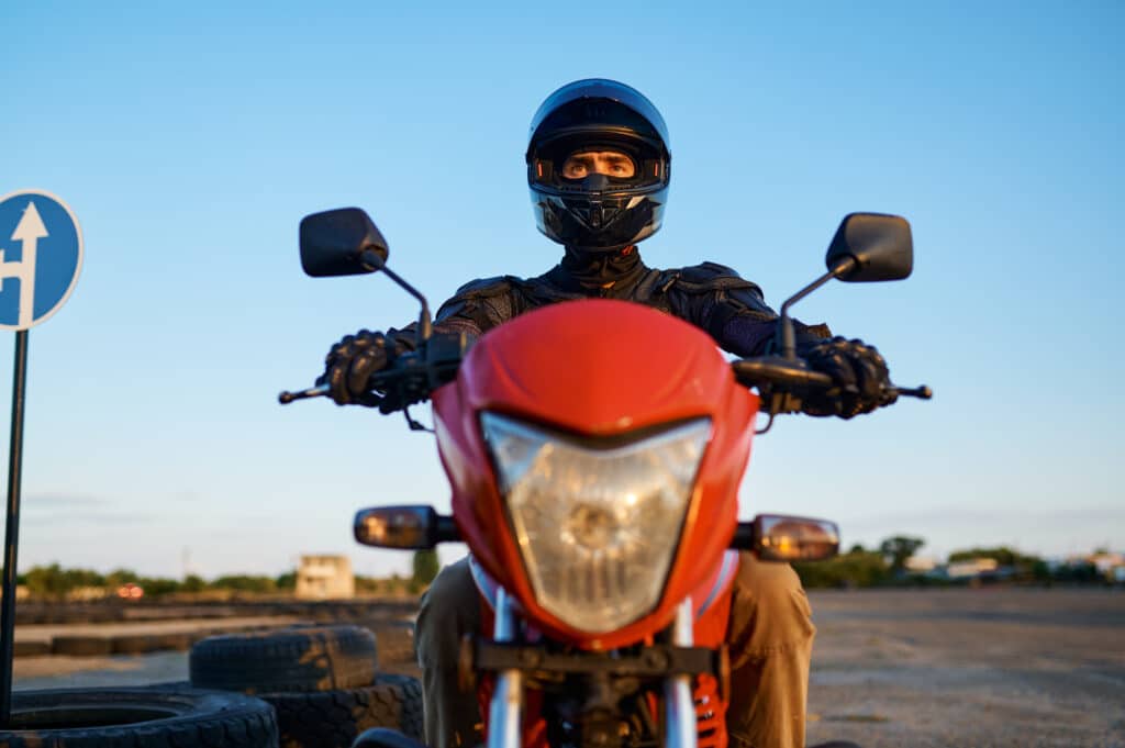 Man on motorbike, front view, motorcycle school