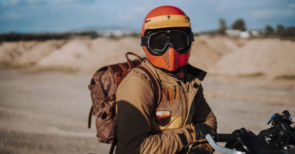 Motorcycle rider wearing helmet and goggles
