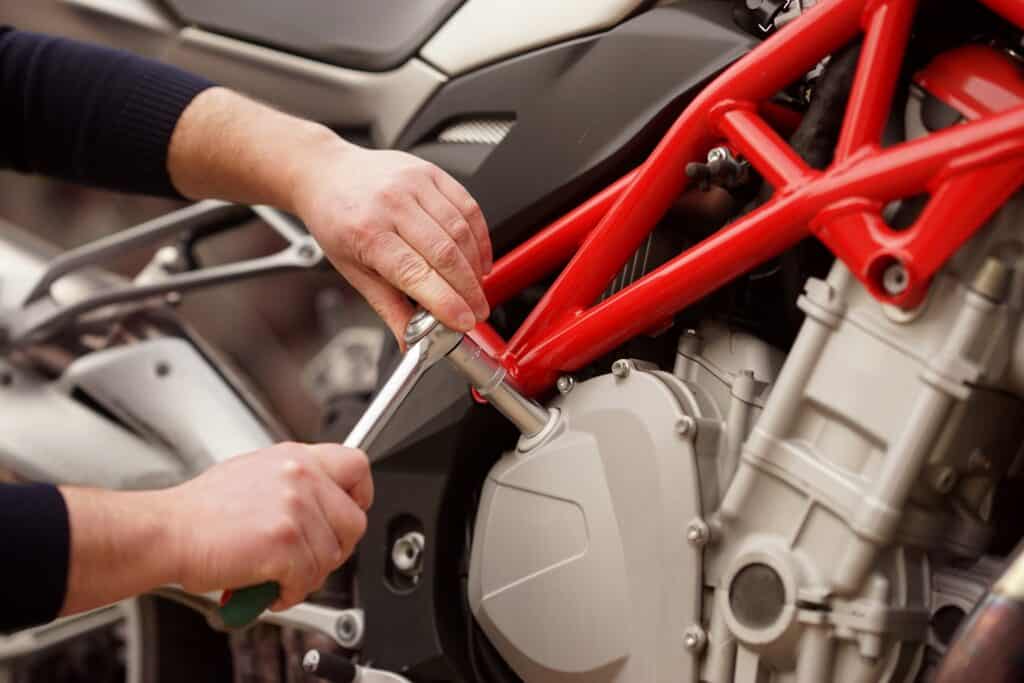 repairing-a-motorcycle-with-a-socket-wrench-2026-01-07-00-29-13-utc