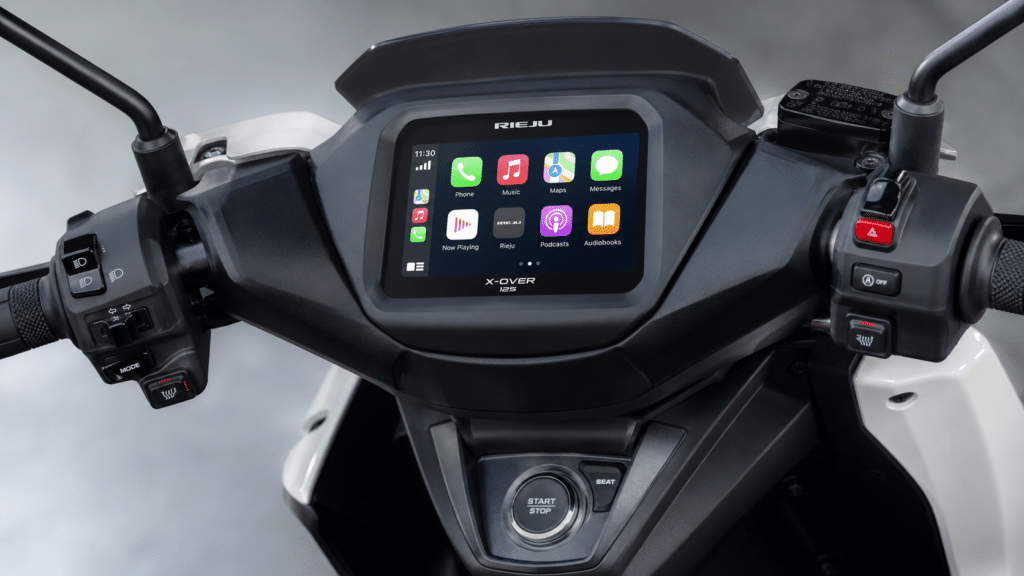 Rieju X-Over 125 dashboard close-up, TFT color screen showing Mirror Link interface